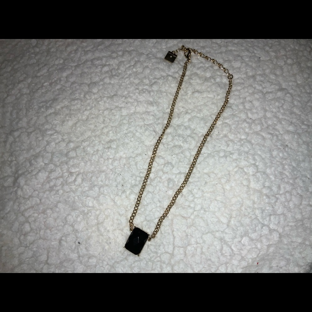 Anne Klein gold tone chain an black glass pendant.